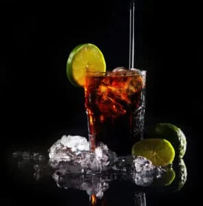 fresh cola drink with green lime