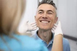 close up doctor checking man