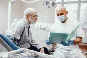 old man sitting dentist s office 2